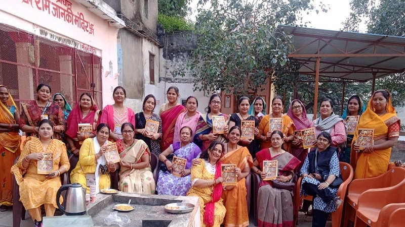 Sisters distributing yellow rice along with invitation to international conference in Chitrakoot  